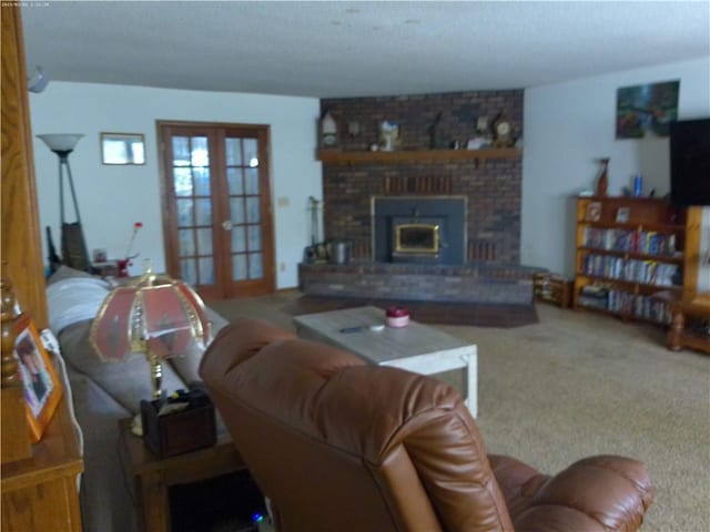 living room featuring carpet, a brick fireplace, and french doors