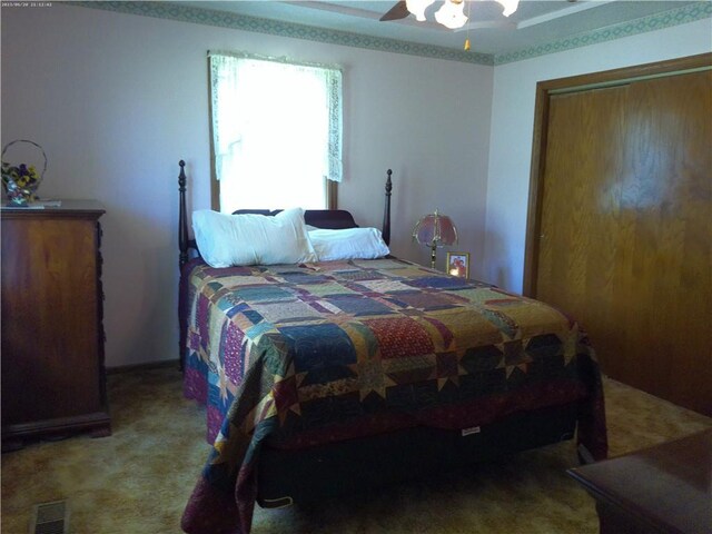 27061 Willow Dr, Paola, KS 66071 - bedroom featuring light carpet, a closet, and ceiling fan
