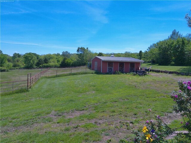 27061 Willow Dr, Paola, KS 66071 - view of yard with an outbuilding, a view of countryside, and an outdoor structure