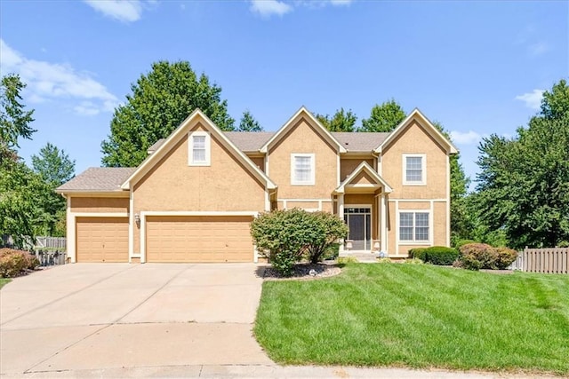 view of front of house with a front lawn and a garage