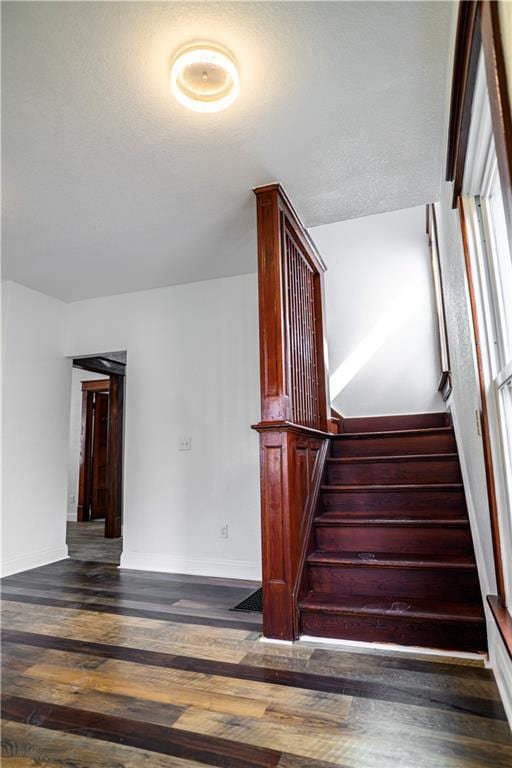 stairs with wood-type flooring