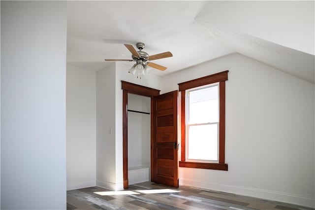 additional living space featuring ceiling fan, dark hardwood / wood-style floors, and vaulted ceiling