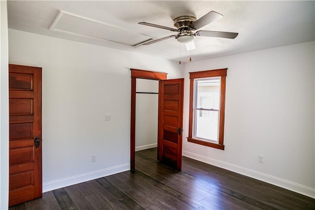 unfurnished bedroom with ceiling fan and dark hardwood / wood-style floors