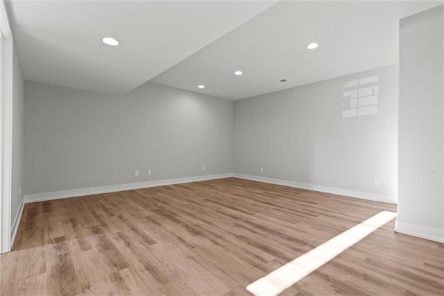 unfurnished room with light hardwood / wood-style floors