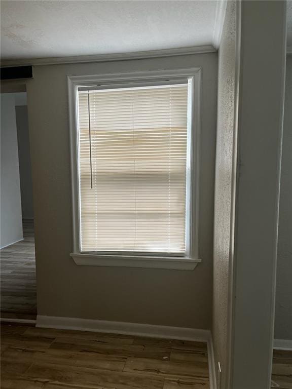 details featuring crown molding and hardwood / wood-style floors