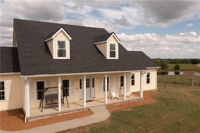 view of front of house with a patio and a front lawn