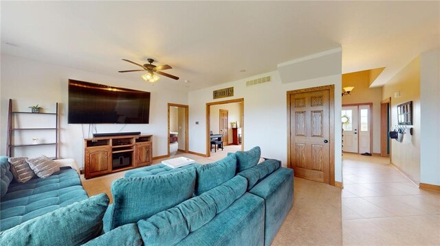 living room with light tile patterned flooring and ceiling fan