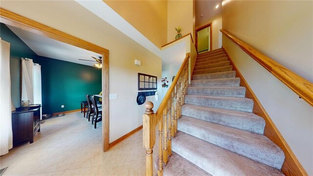 stairway featuring tile patterned flooring