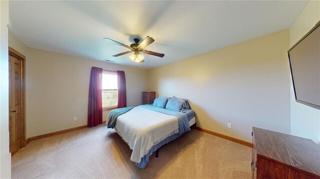 carpeted bedroom with ceiling fan