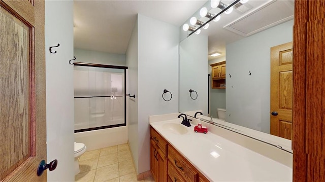 full bathroom featuring enclosed tub / shower combo, tile patterned flooring, vanity, and toilet