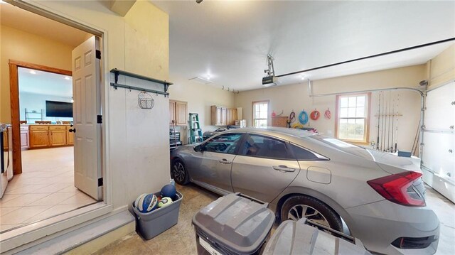 garage featuring a garage door opener