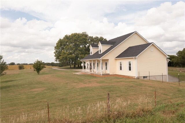 back of house with a yard