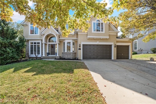 view of front of house featuring a garage and a front lawn