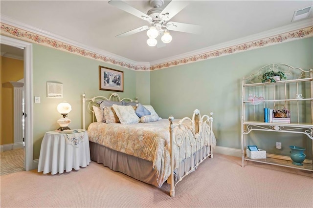 carpeted bedroom with crown molding and ceiling fan