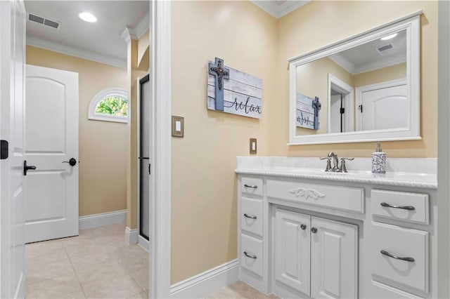 bathroom featuring crown molding, vanity, and tile patterned flooring