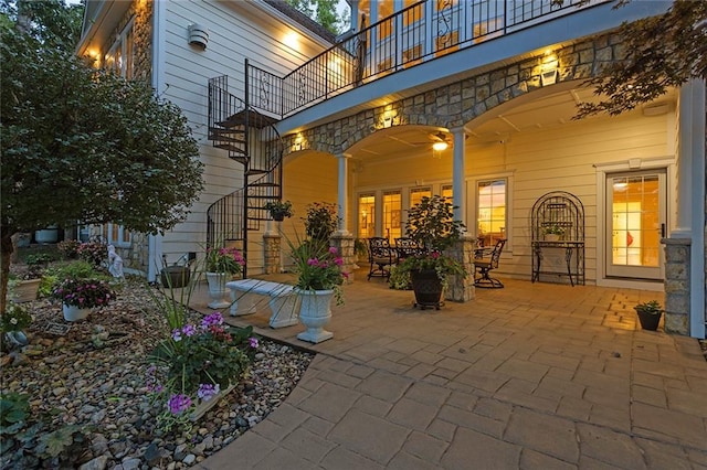 view of patio featuring a balcony