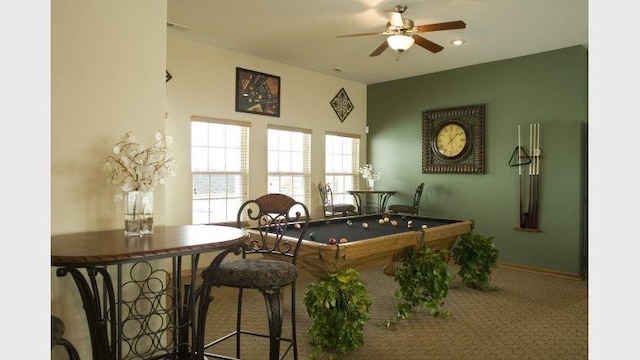 carpeted dining area featuring ceiling fan