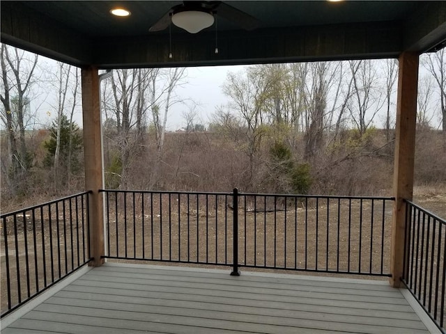 wooden terrace featuring a ceiling fan