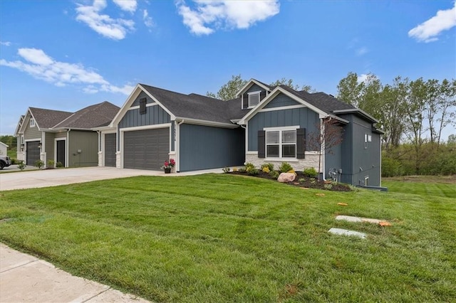 14574 Aurora Ln, Basehor, KS 66007 - craftsman house featuring board and batten siding, an attached garage, driveway, and a front yard
