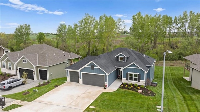 14574 Aurora Ln, Basehor, KS 66007 - view of front of property with a garage, board and batten siding, driveway, a front yard, and a shingled roof