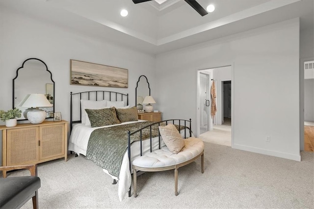 14574 Aurora Ln, Basehor, KS 66007 - bedroom featuring light carpet, recessed lighting, a ceiling fan, a tray ceiling, and baseboards