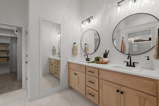 14574 Aurora Ln, Basehor, KS 66007 - full bath featuring marble look tiles, double vanity, and baseboards