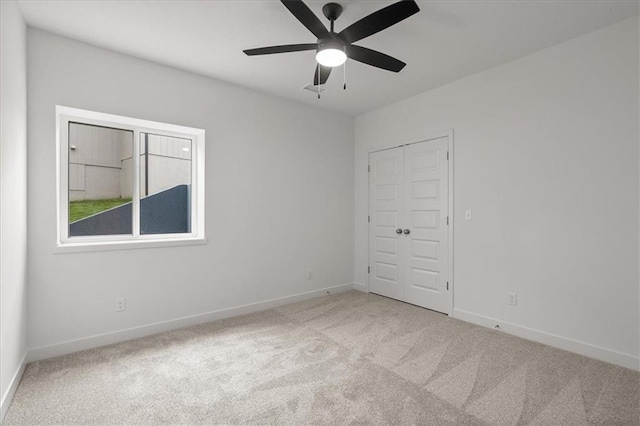 14574 Aurora Ln, Basehor, KS 66007 - empty room featuring carpet floors, baseboards, and ceiling fan