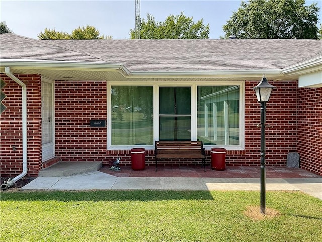 exterior space featuring a lawn and a patio area