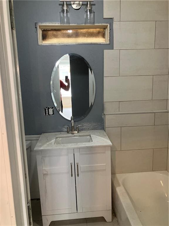 bathroom featuring a bathtub and vanity