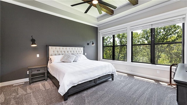 bedroom with ceiling fan, carpet floors, and ornamental molding