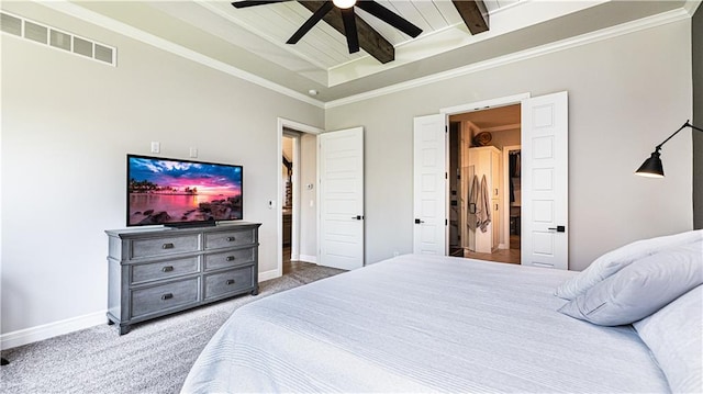 bedroom with carpet flooring, ceiling fan, crown molding, and beamed ceiling