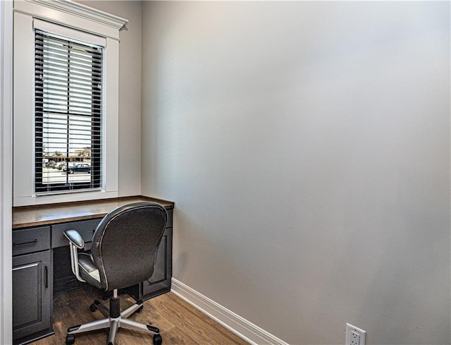 office space with dark hardwood / wood-style flooring