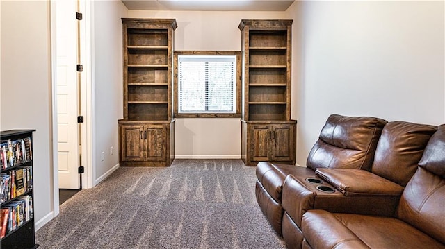 living area featuring carpet