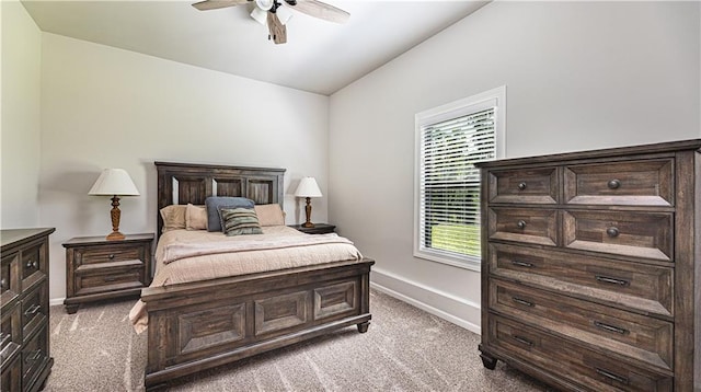 carpeted bedroom featuring lofted ceiling and ceiling fan