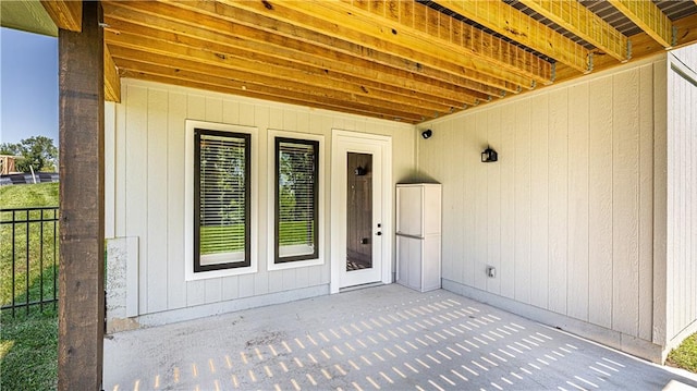 property entrance featuring a patio area