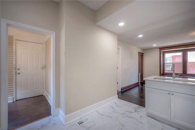 interior space with sink and light hardwood / wood-style flooring