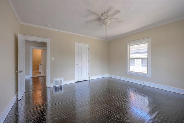 spare room with dark wood-type flooring, ceiling fan, and ornamental molding