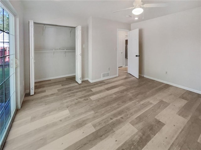 unfurnished bedroom with a closet, ceiling fan, and light hardwood / wood-style flooring