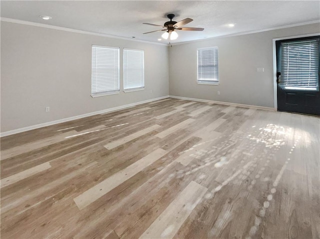 unfurnished room featuring light wood-type flooring, ceiling fan, and ornamental molding