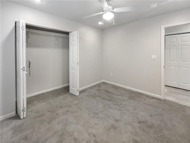 unfurnished bedroom with a closet, ceiling fan, and carpet floors