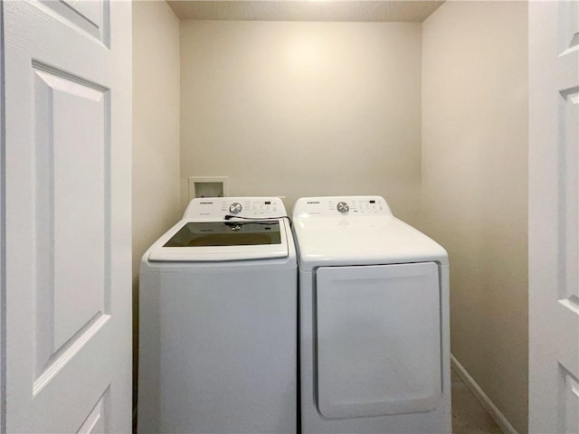 laundry room with washer and dryer