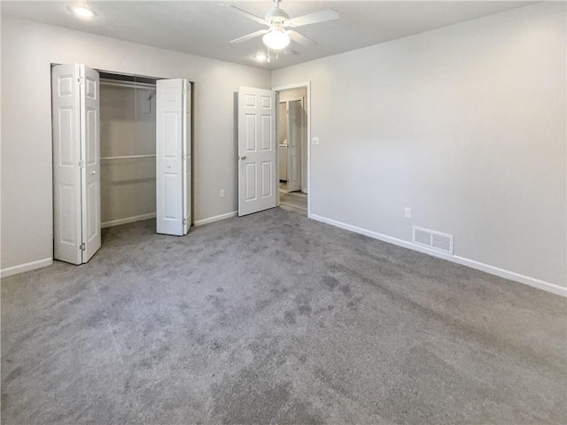 unfurnished bedroom with light carpet, ceiling fan, and a closet