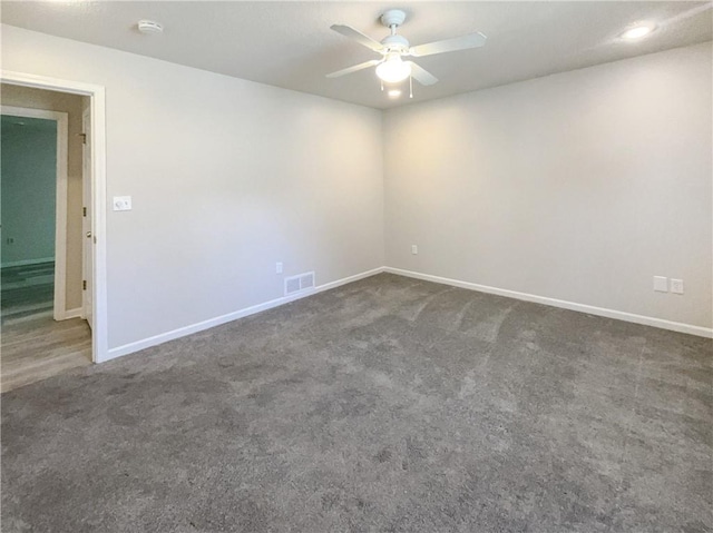 unfurnished room featuring ceiling fan and carpet floors