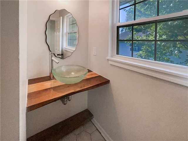 bathroom with sink and a healthy amount of sunlight