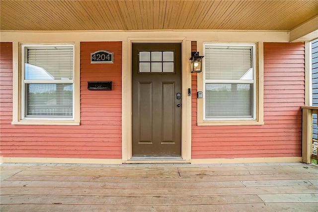 property entrance with covered porch