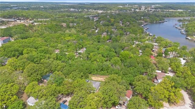 aerial view featuring a water view and a forest view