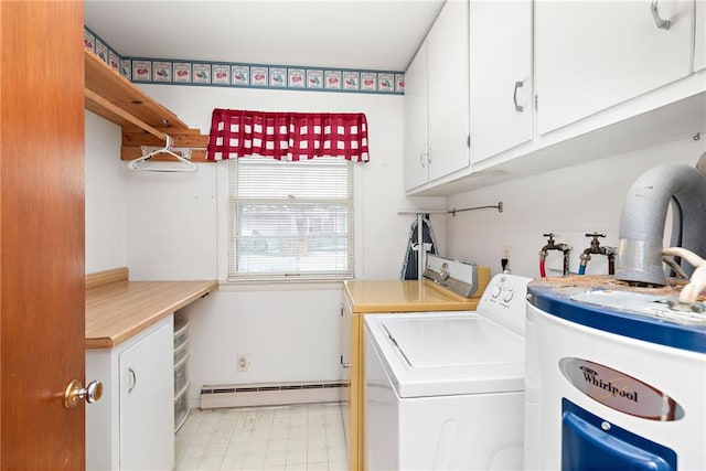 laundry room with water heater, washer and clothes dryer, light floors, a baseboard radiator, and cabinet space