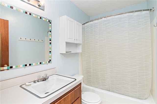 full bath with shower / bath combination with curtain, toilet, vanity, and a textured ceiling