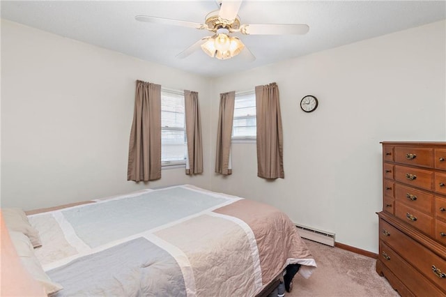 bedroom featuring a ceiling fan, light carpet, baseboards, and a baseboard heating unit