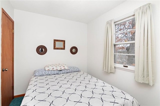 bedroom featuring light colored carpet